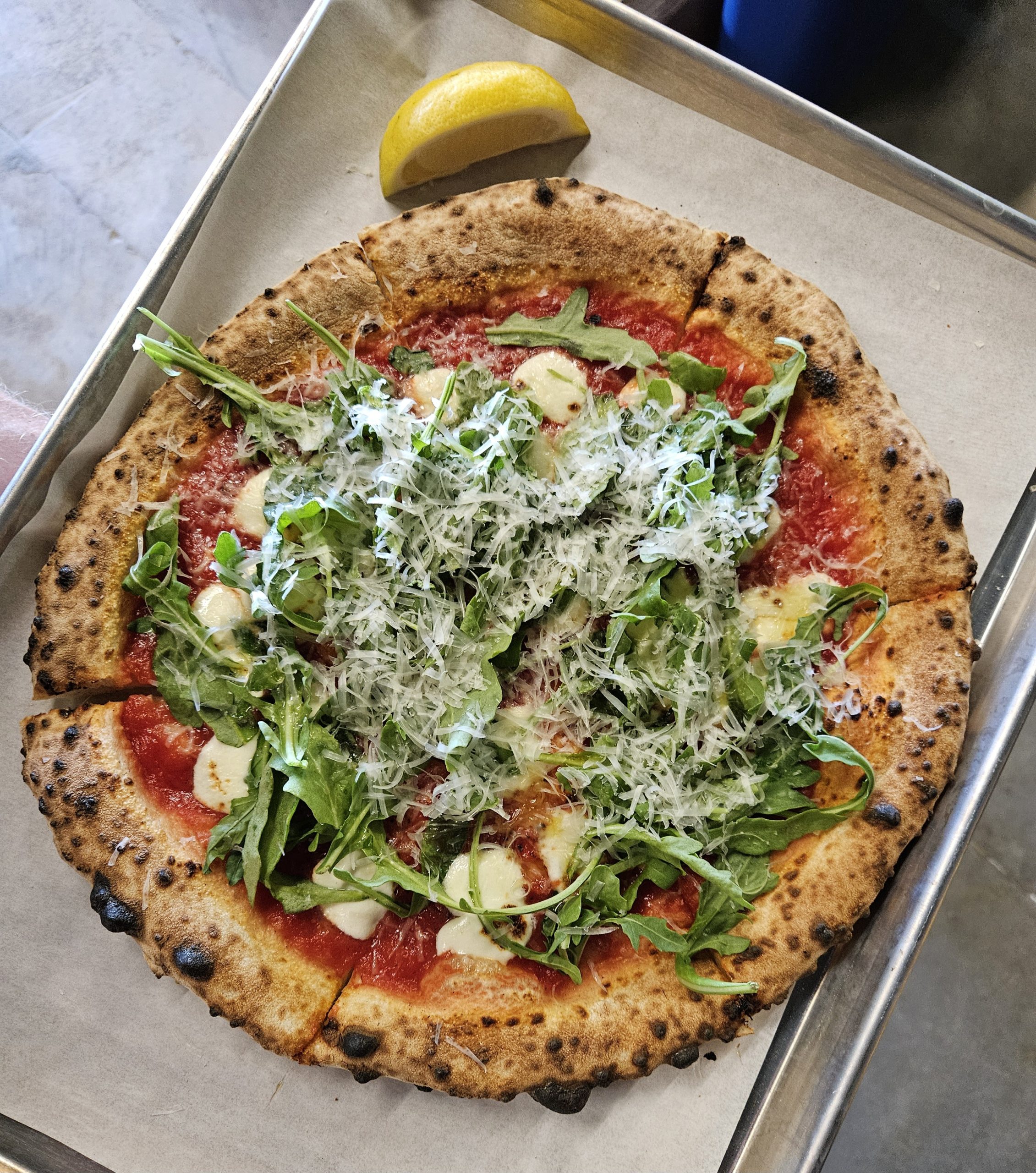 Margherita pizza with fresh arugula